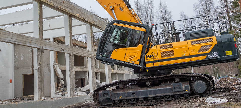 HX520L hyundai excavator at work on a demolishing project