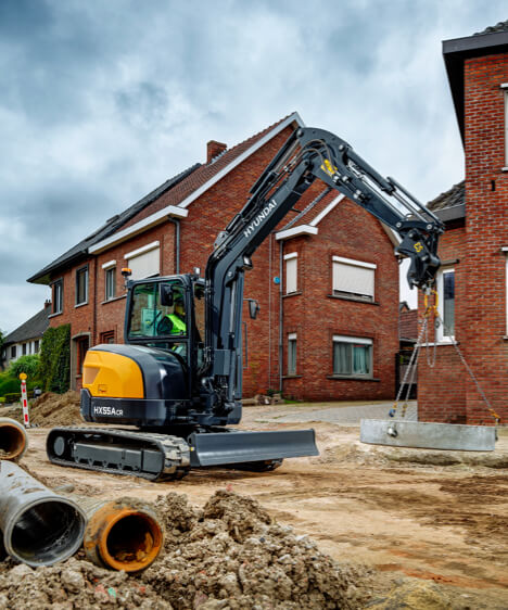 HX55A CR Compact Excavator utility work housing site